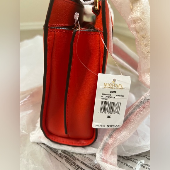 MICHAEL KORS
MOTT
35SOGOXC7L
LG CLUTCH XBODY
LEATHER
MANDARIN - Picture 9 of 11